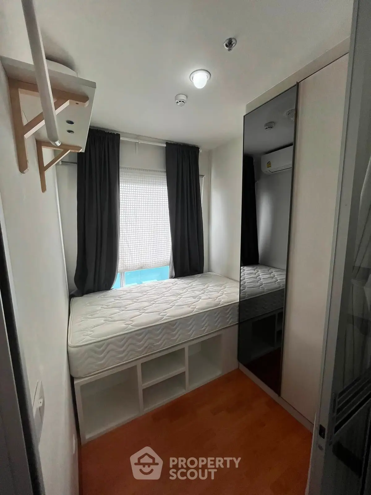 Cozy bedroom with built-in storage and natural light