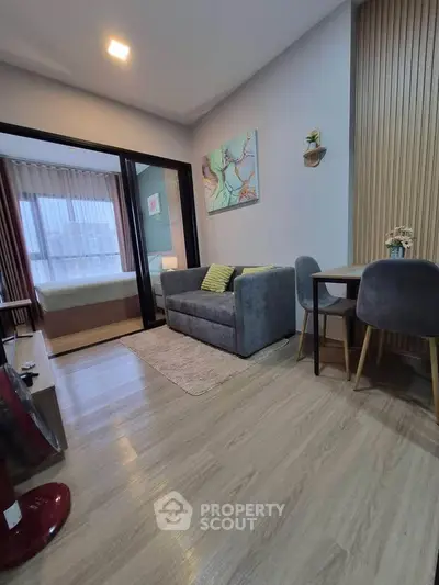 Modern living room with cozy seating and stylish decor in a contemporary apartment.