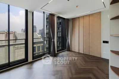 Spacious modern corner unit with floor-to-ceiling windows and stunning city view.