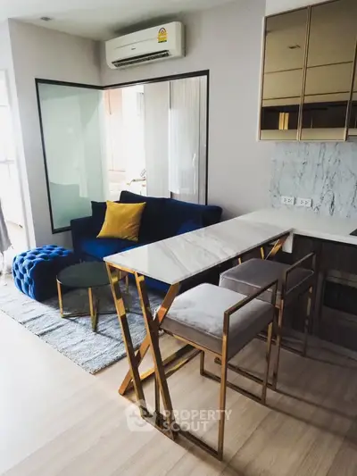 Modern living room with stylish furniture and open kitchen layout