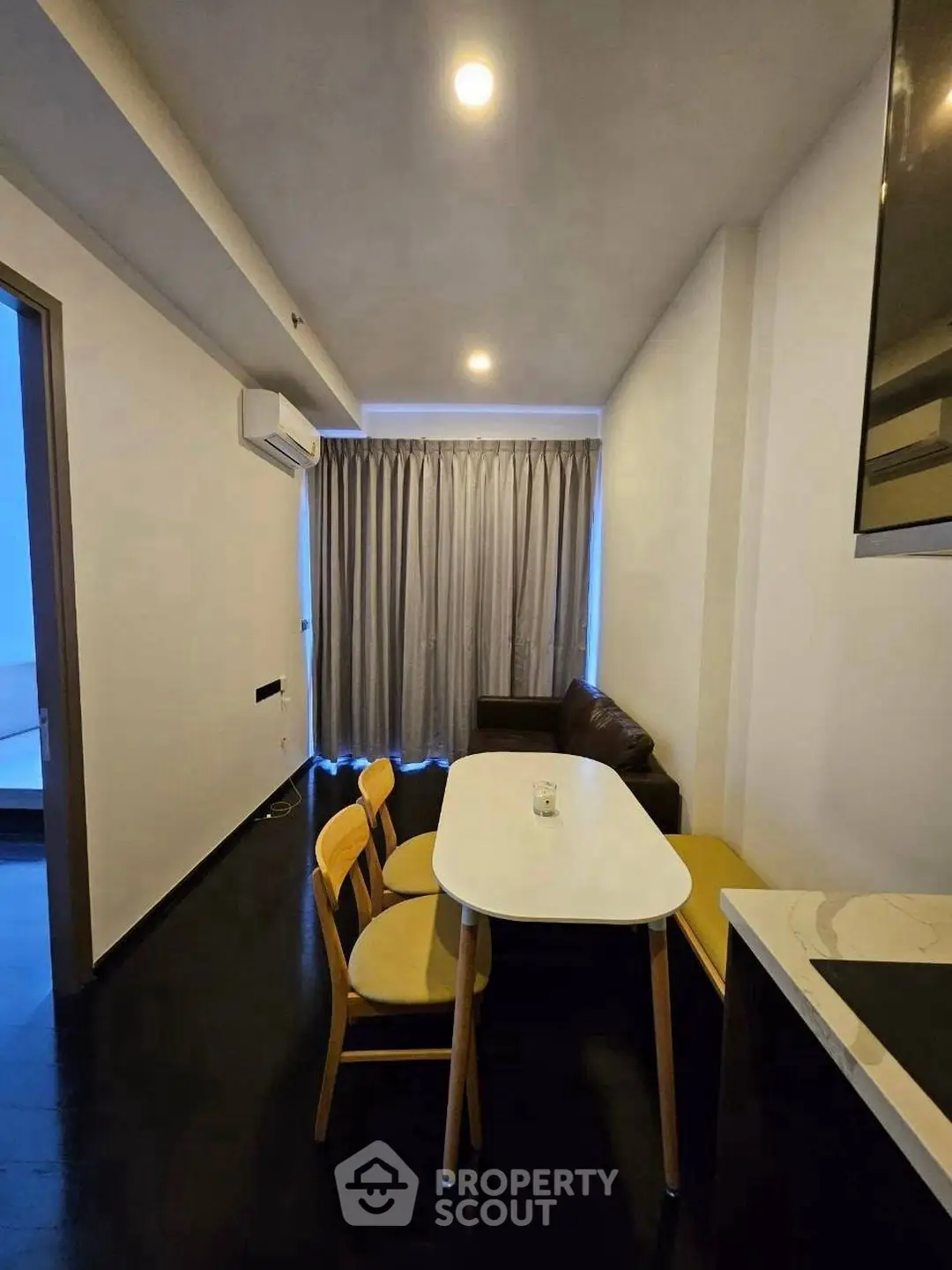 Modern apartment interior with cozy dining area and stylish furniture