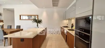 Modern kitchen with sleek cabinetry and island in elegant open layout