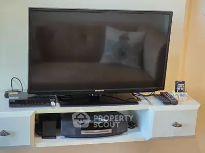 Modern living room with sleek entertainment center and flat-screen TV
