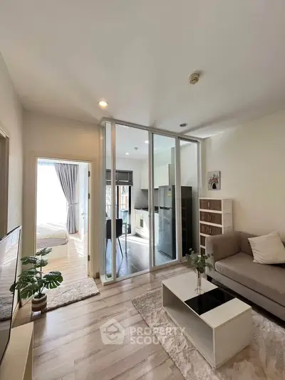 Modern living room with open layout and stylish decor in a contemporary apartment.