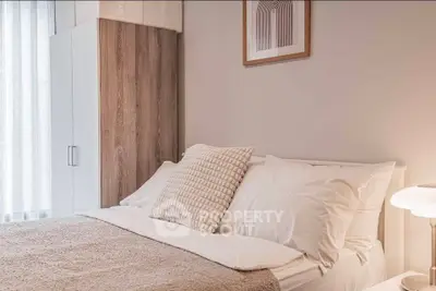 Cozy bedroom with modern decor and soft lighting, featuring a comfortable bed and stylish wardrobe.