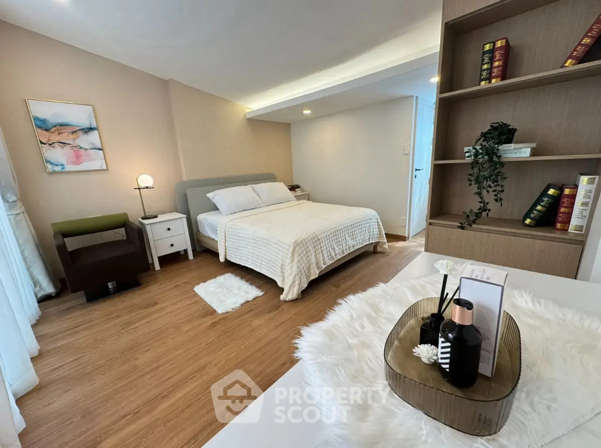 Spacious bedroom with modern decor and cozy ambiance