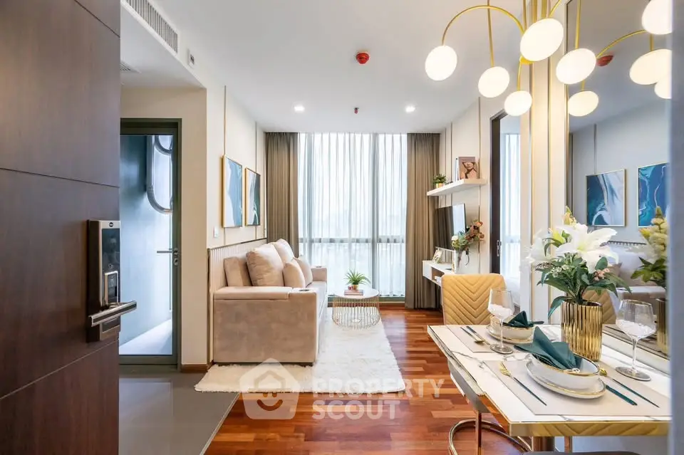 Elegant modern living room with stylish decor and dining area, featuring large windows and wooden flooring.