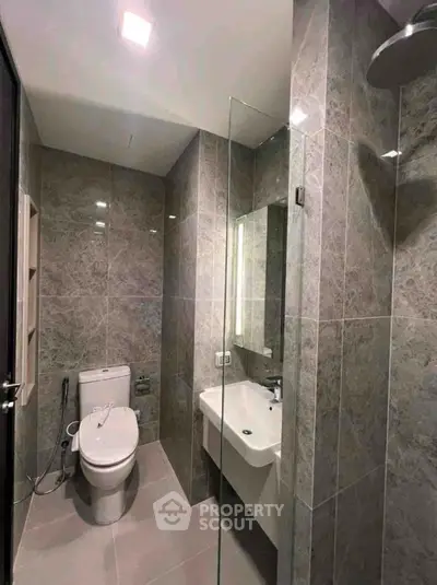 Modern bathroom with sleek design and glass shower enclosure