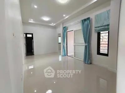 Spacious and bright living room with modern design and elegant curtains