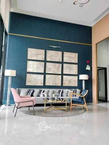 Chic modern living room with elegant blue textured wall, stylish sofa, and artistic wall panels, perfect for upscale urban living.