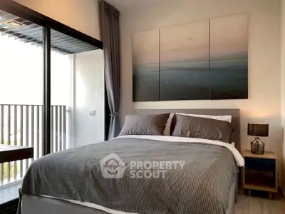 Modern bedroom with balcony access and stylish decor