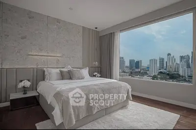 Luxurious bedroom with stunning city view and elegant decor