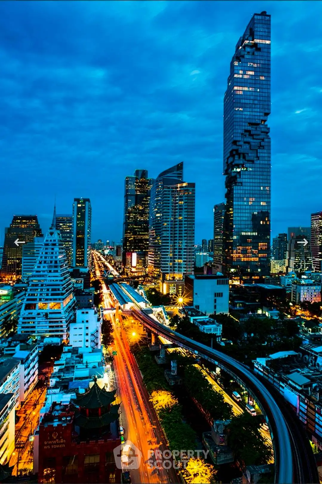 Stunning cityscape view with iconic skyscrapers and vibrant night lights.