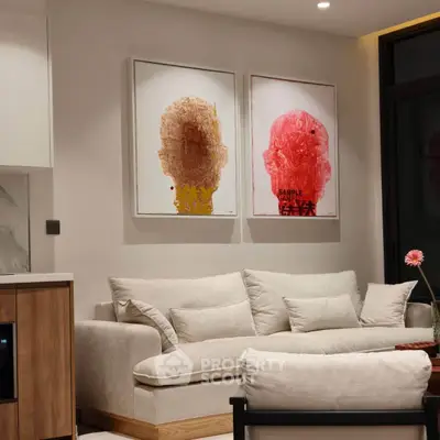 Modern living room with stylish artwork and cozy white sofa