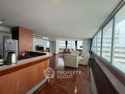 Spacious corner unit with panoramic city views and elegant hardwood floors.