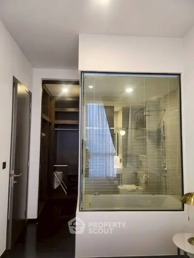 Modern bathroom with glass partition and sleek design