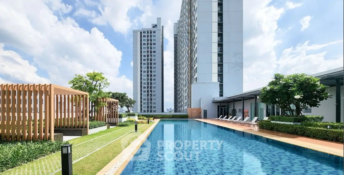 Luxurious high-rise apartment with stunning pool and lush garden view