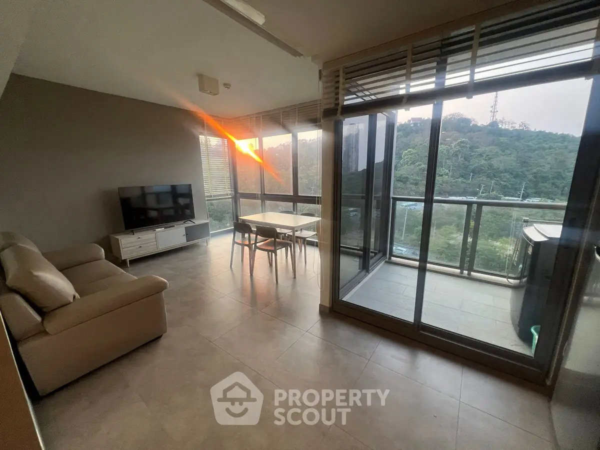 Spacious living room with stunning view and large balcony in modern apartment