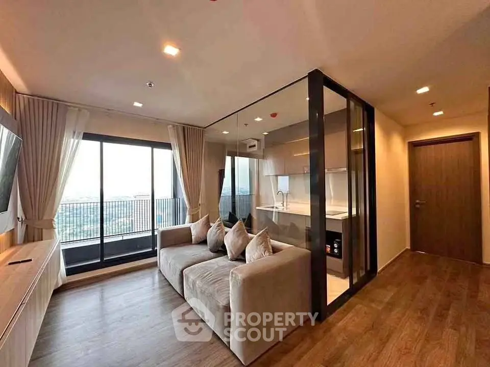 Modern living room with glass partition and balcony view in luxury apartment