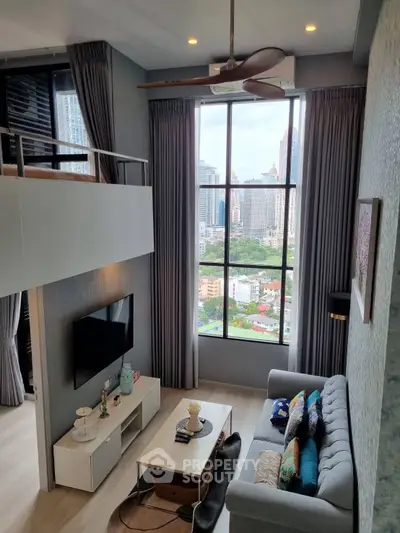 Modern loft living room with high ceiling and city view, featuring stylish decor and large windows.