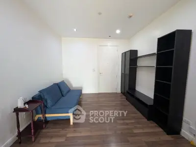 Spacious living room with modern furniture and wooden flooring