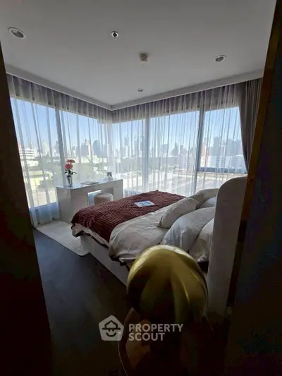Luxurious bedroom with panoramic city views and elegant decor