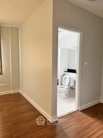Modern apartment with wooden flooring and attached bathroom