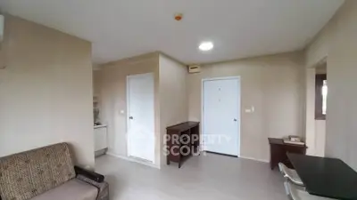 Cozy apartment interior with neutral tones and modern furniture, ideal for urban living.