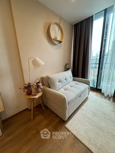 Cozy living room with modern decor and city view balcony