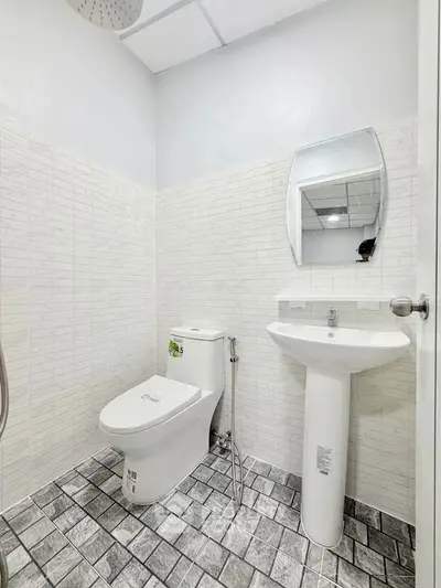 Modern bathroom with sleek fixtures and stylish tile flooring