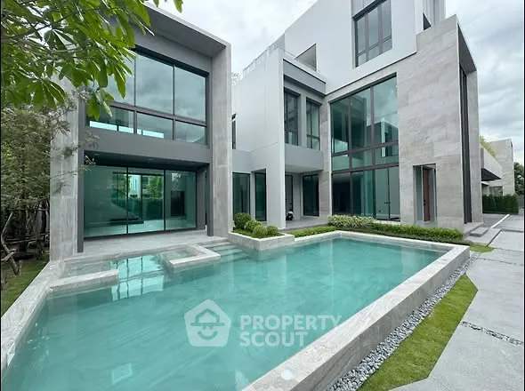 Luxurious modern home with stunning pool and large windows