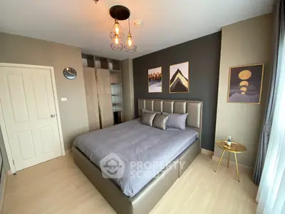 Modern bedroom with stylish decor and ample natural light