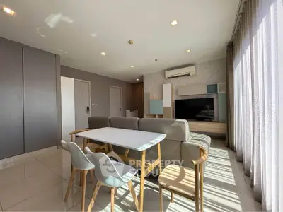 Spacious modern living room with natural light and stylish furniture