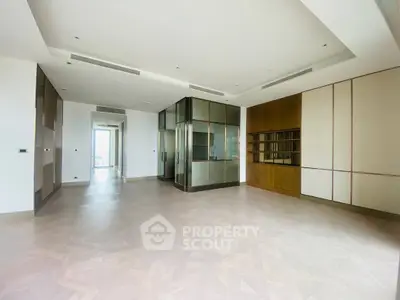 Spacious modern living room with elegant glass partitions and wooden accents