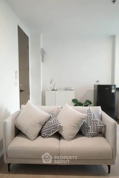 Modern living room with stylish sofa and minimalist decor