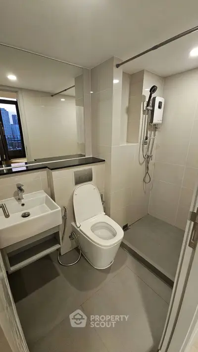 Modern bathroom with sleek fixtures and city view window