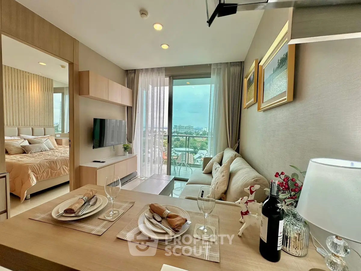 Modern open-plan living room with city view and elegant decor