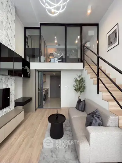 Modern duplex living room with stylish decor and mezzanine view