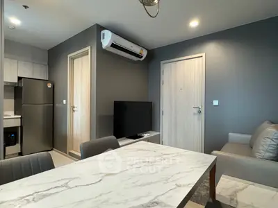 Modern apartment interior with sleek kitchen and cozy living area