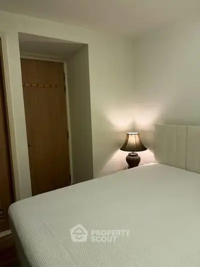 Cozy bedroom with soft lighting and minimalist decor