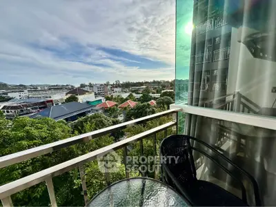 Charming balcony with scenic city view, perfect for relaxation and enjoying the outdoors.