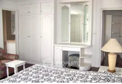 Spacious bedroom with built-in wardrobe and elegant decor