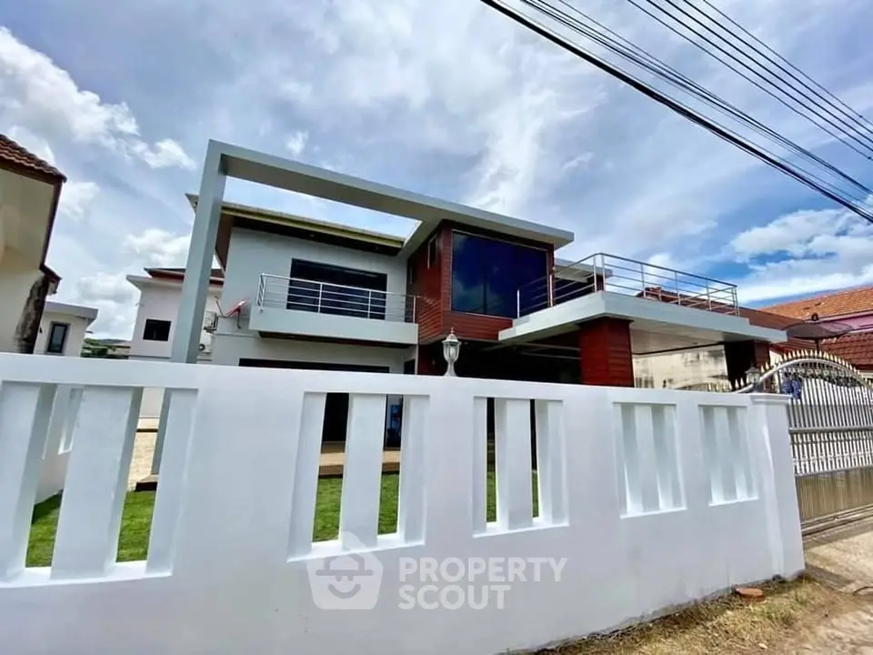 Modern two-story house with sleek design and spacious balcony