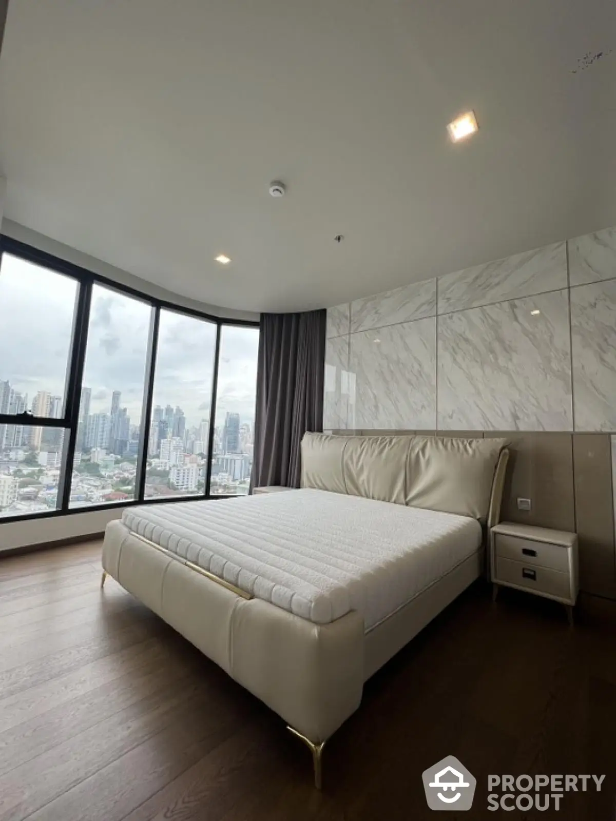 Luxurious bedroom with stunning city view and modern design