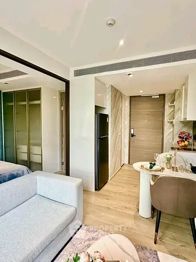 Modern apartment interior with open kitchen and cozy living area