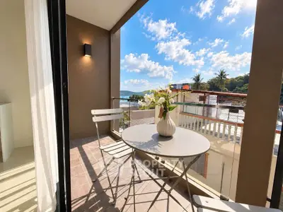 Charming balcony with ocean view, perfect for relaxation and enjoying the scenery.