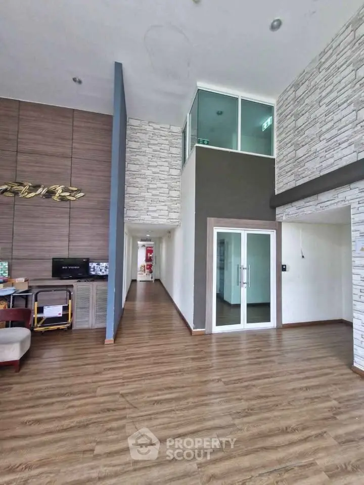 Spacious modern living room with high ceiling and stylish decor