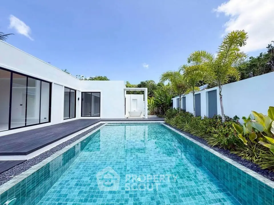 Luxurious modern villa with private pool and lush garden, perfect for serene living.