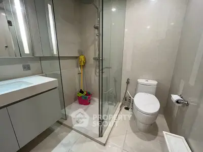 Modern bathroom with glass shower and sleek fixtures