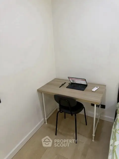 Cozy study nook with desk and chair in modern apartment